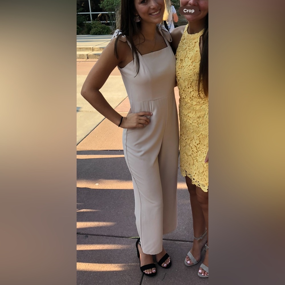 Nude jumpsuit with ties on shoulders
